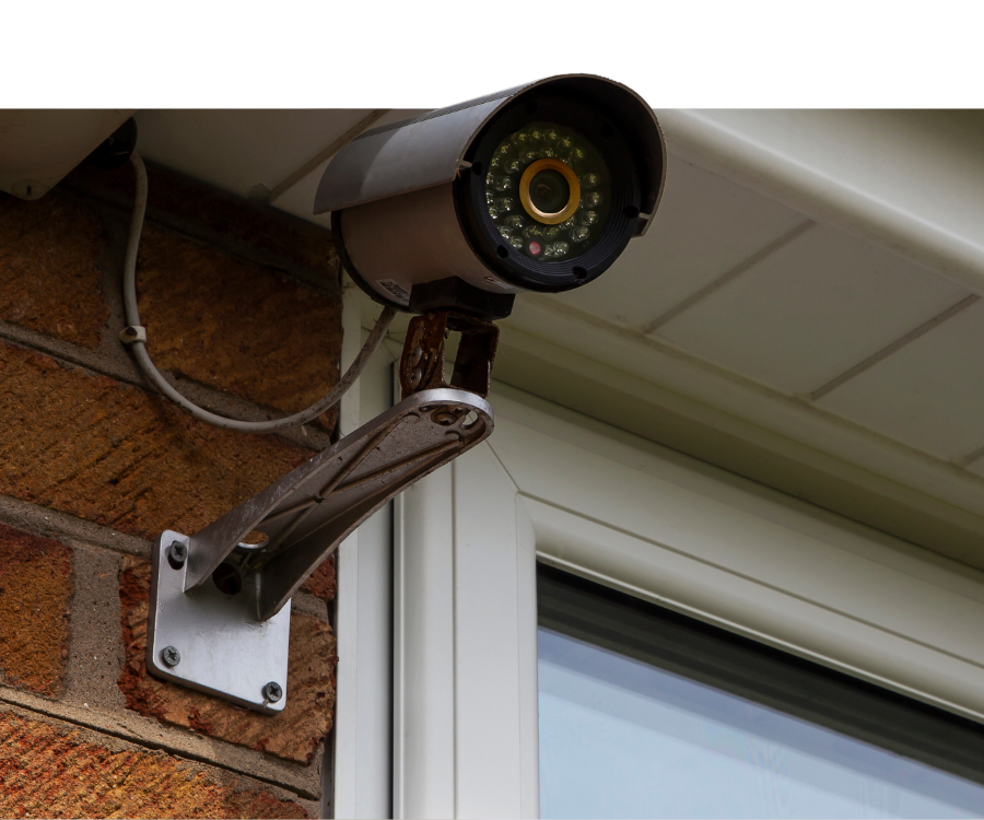 Security and Fire Monitoring Systems in Branson, MO - img2 Security camera mounted on home